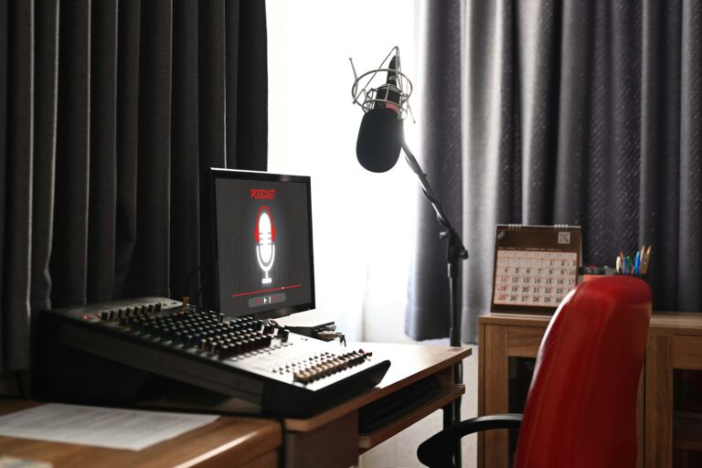 Home studio podcast interior with professional microphone, computer pc and headphone.